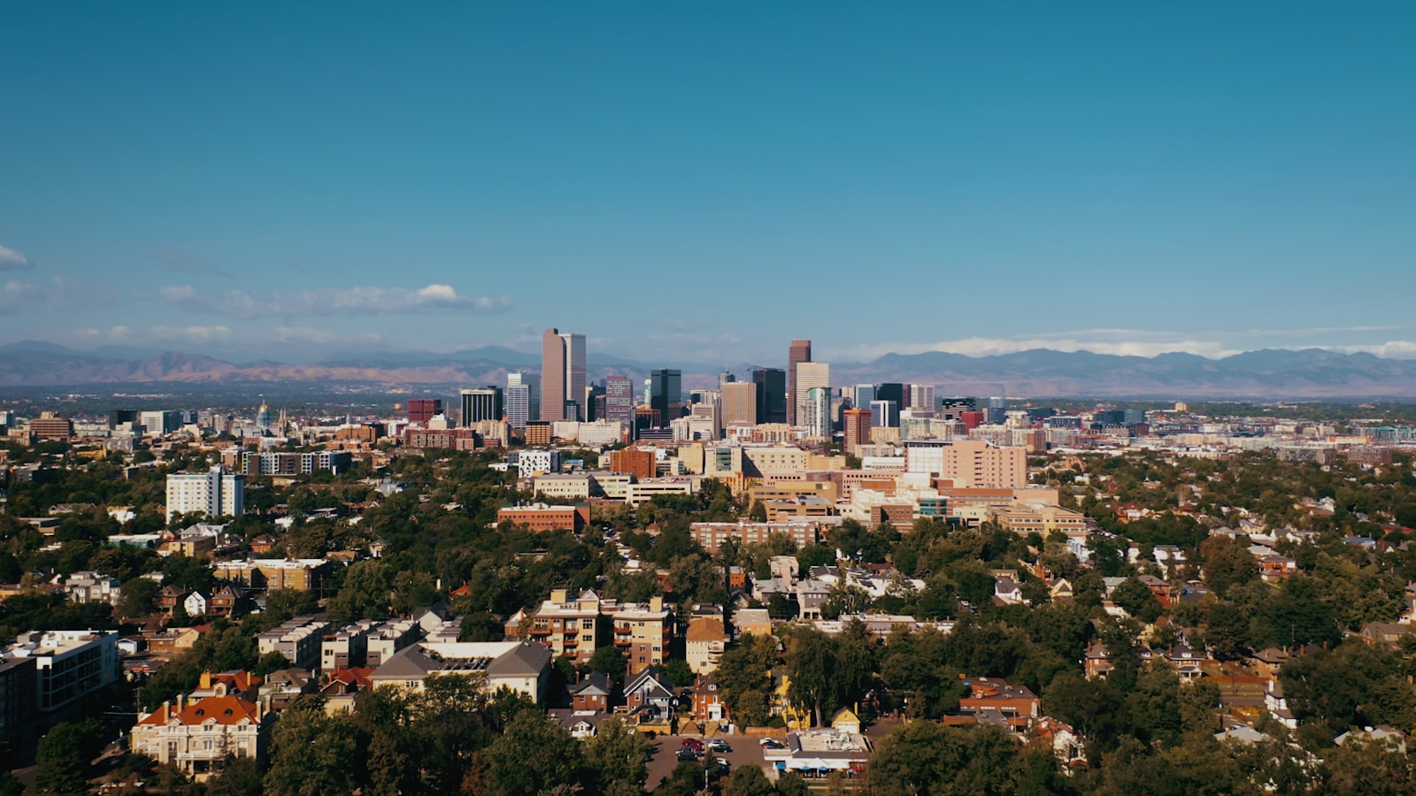 Denver Colorado skyline with Rocky Mountains in background