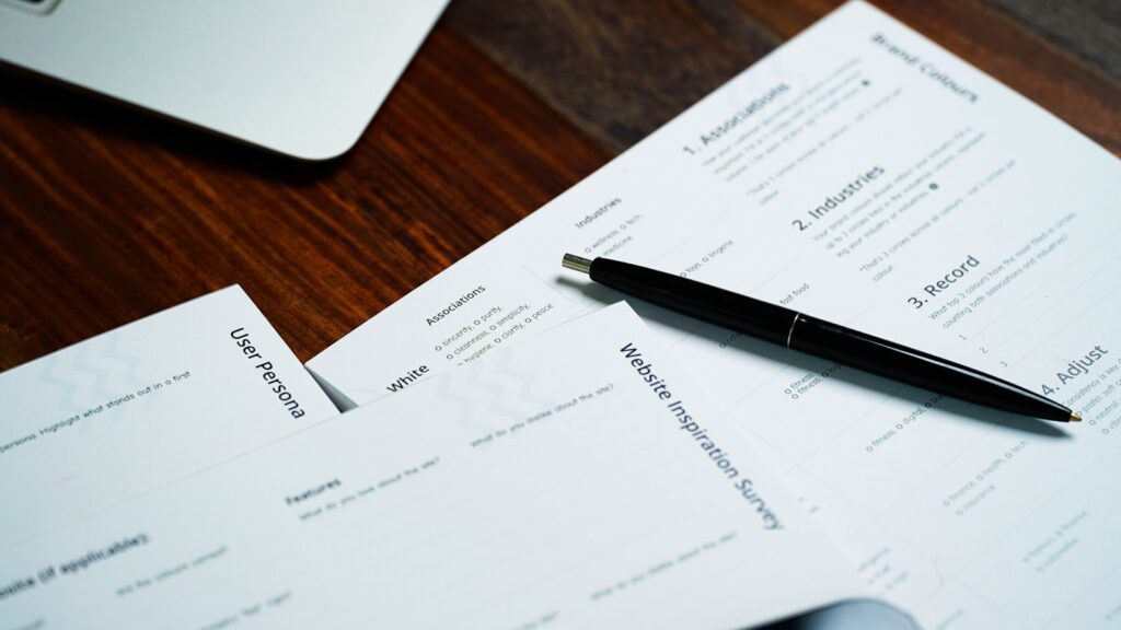 Payroll tax form and pen on a desk