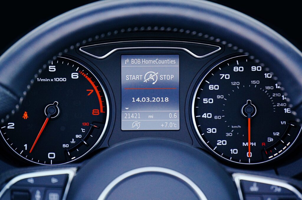 Close-up of a car dashboard odometer and speedometer, illustrating business miles tracked under the 2026 IRS standard mileage rate